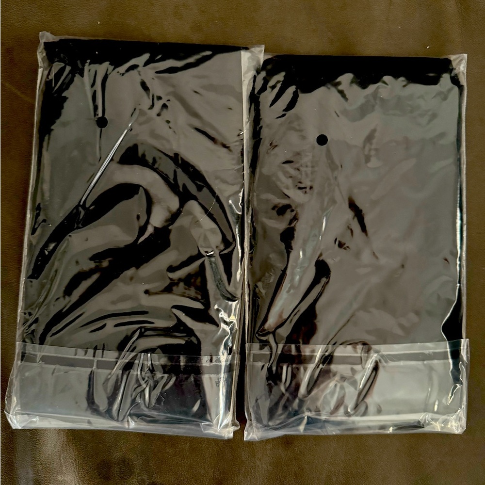 2, Unopened plain black tights.